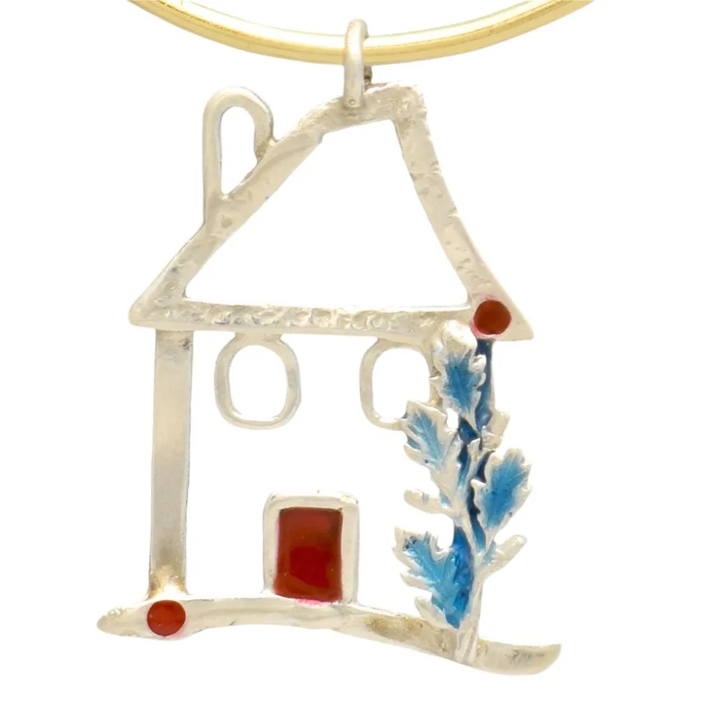 Sterling silver charm on plexiglass - House